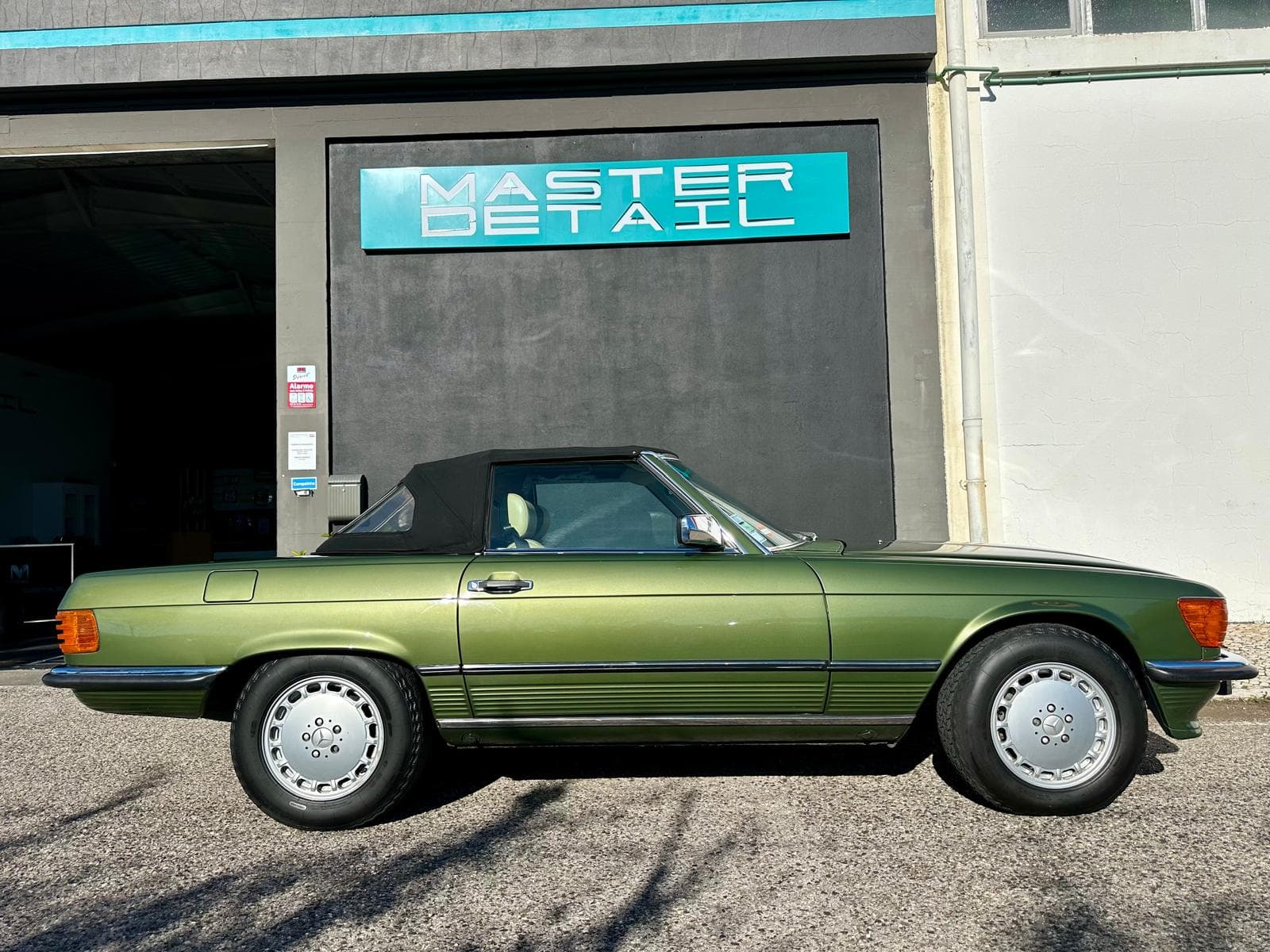 Green Mercedes SL500 convertible after full detail and wax