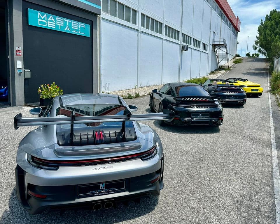 Multiple Porsches lined up for detailing service