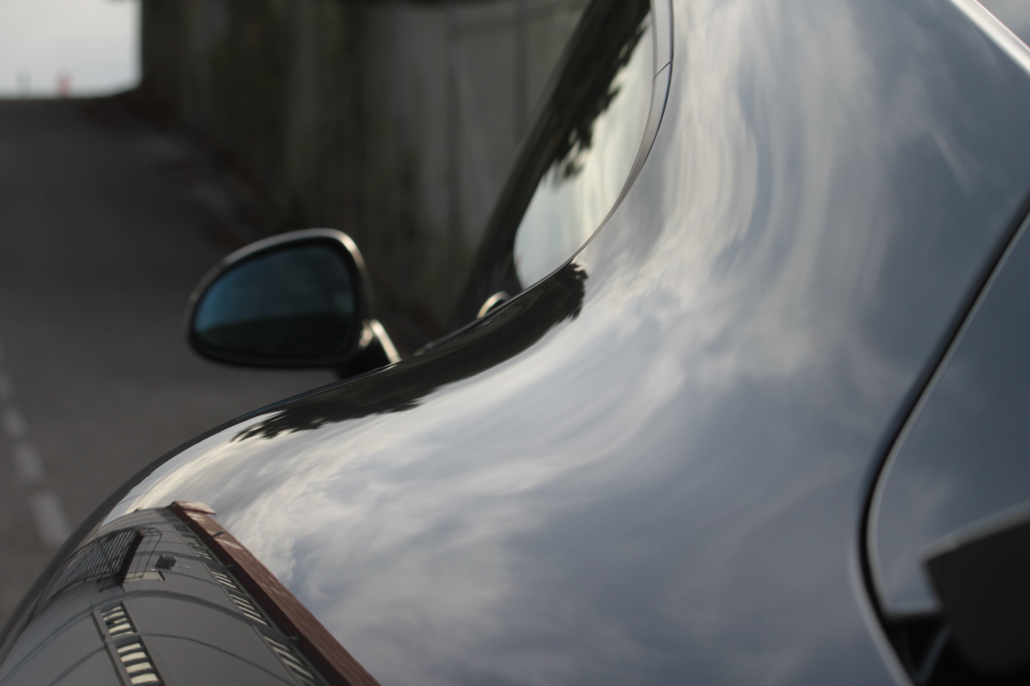 Porsche paint correction showing mirror-like reflections