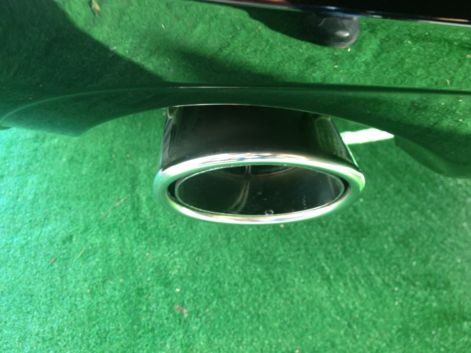 Close-up of paint correction showing mirror finish