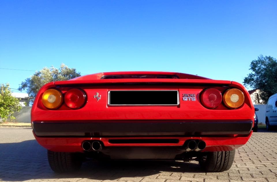 Classic red Ferrari 308 GTS rear view after full detail and ceramic coating