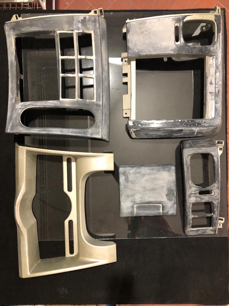 Interior plastic restoration showing faded and restored pieces