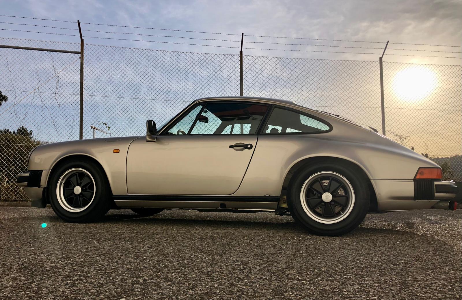 Silver Porsche 911 SC at sunset after full detail and wax