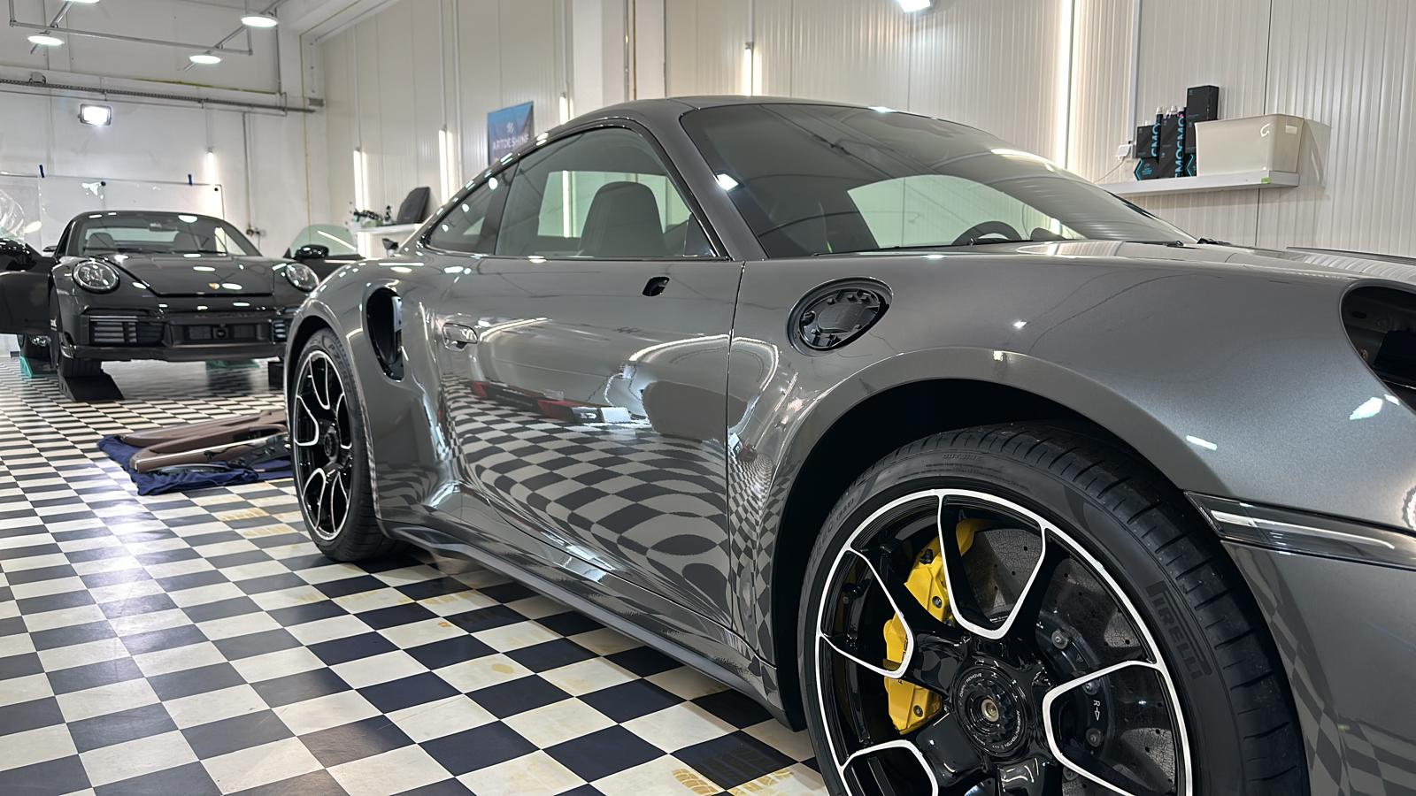 Grey Porsche 911 Turbo in Master Detail garage prepared for PPF and ceramic coating in Leiria